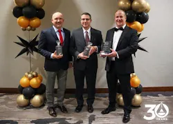 Cybertrol executives celebrate the company's 30th anniversary with commemorative plaques. Cybertrol executives celebrate the company's 30th anniversary with commemorative plaques.