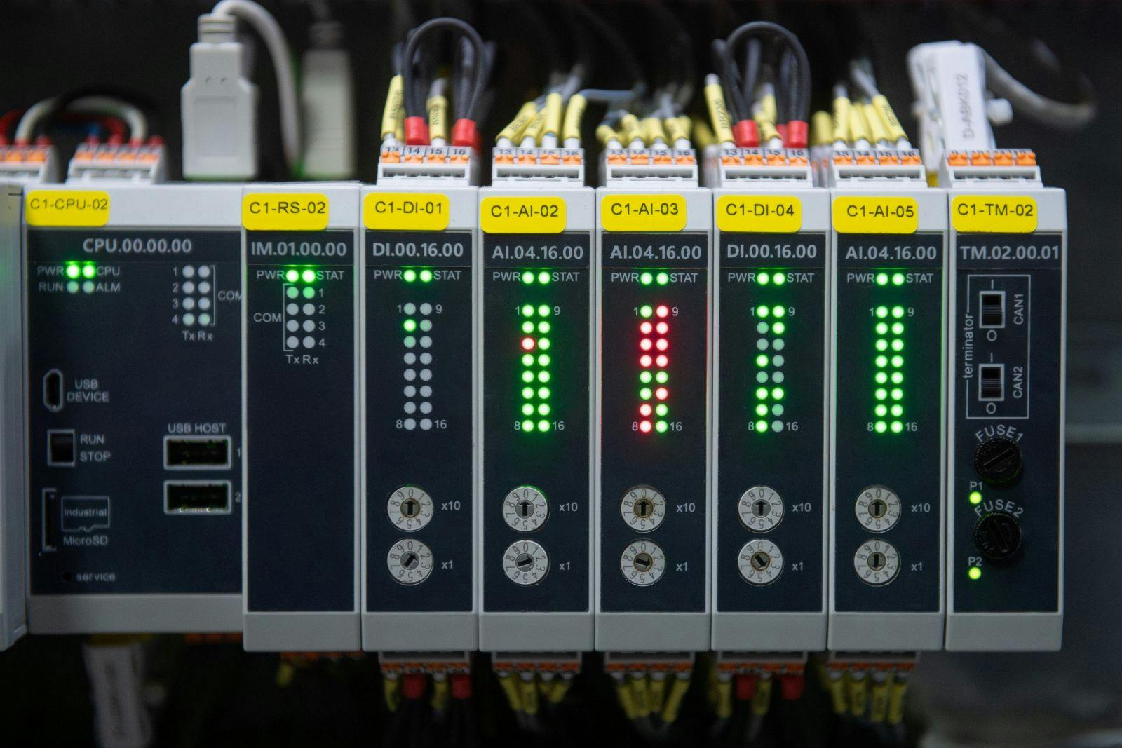 Programmable Logic Controller (PLC) comprised of analog and digital input and output with power supply and processor module.