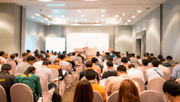 1660316653181 Largegroupofpeoplelisteningtoapresentationataconference