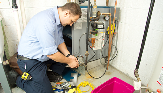 technician-working-on-a-furnace