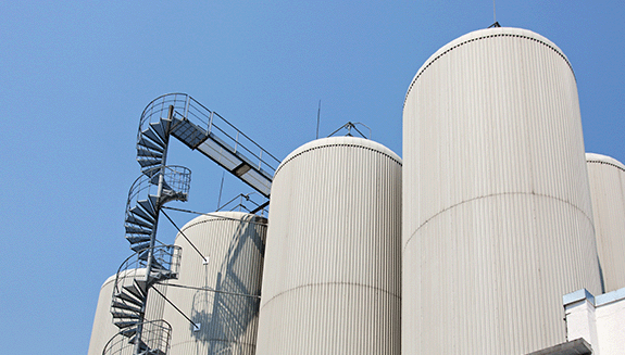 Industrial-distillating-columns-in-factory-site-with-spiral-stairs