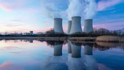 Image of nuclear power station and its reflection in water Image of nuclear power station and its reflection in water