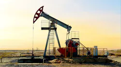 Crude oil pump jack at oilfield on sunset background Crude oil pump jack at oilfield on sunset background