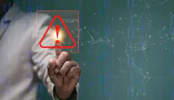 Businessman pointing to triangle caution warning sign for notification error and maintenance concept Businessman pointing to triangle caution warning sign for notification error and maintenance concept