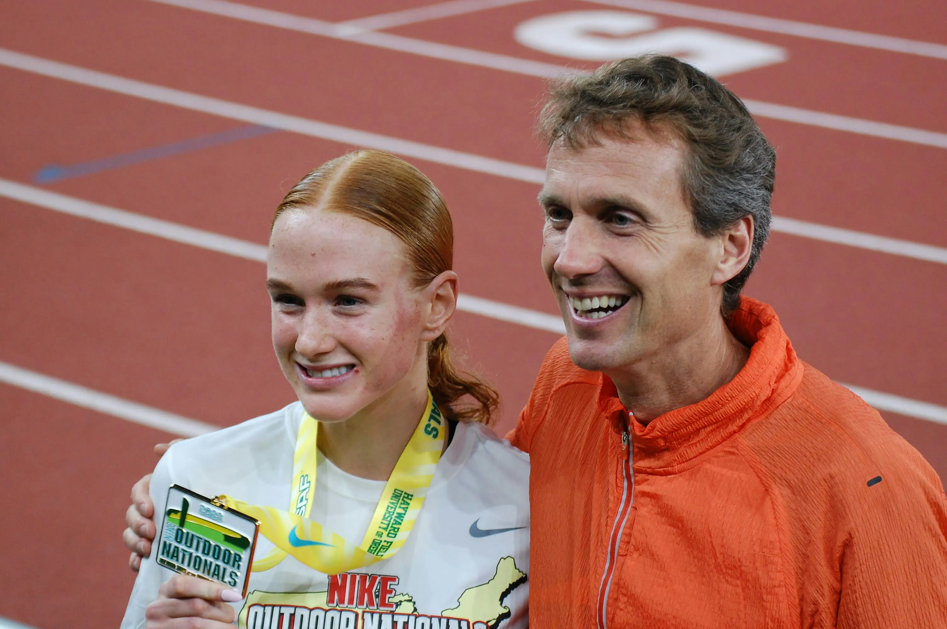 Hedengren poses with his daughter, Jane, following her record-breaking race Hedengren poses with his daughter, Jane, following her record-breaking race