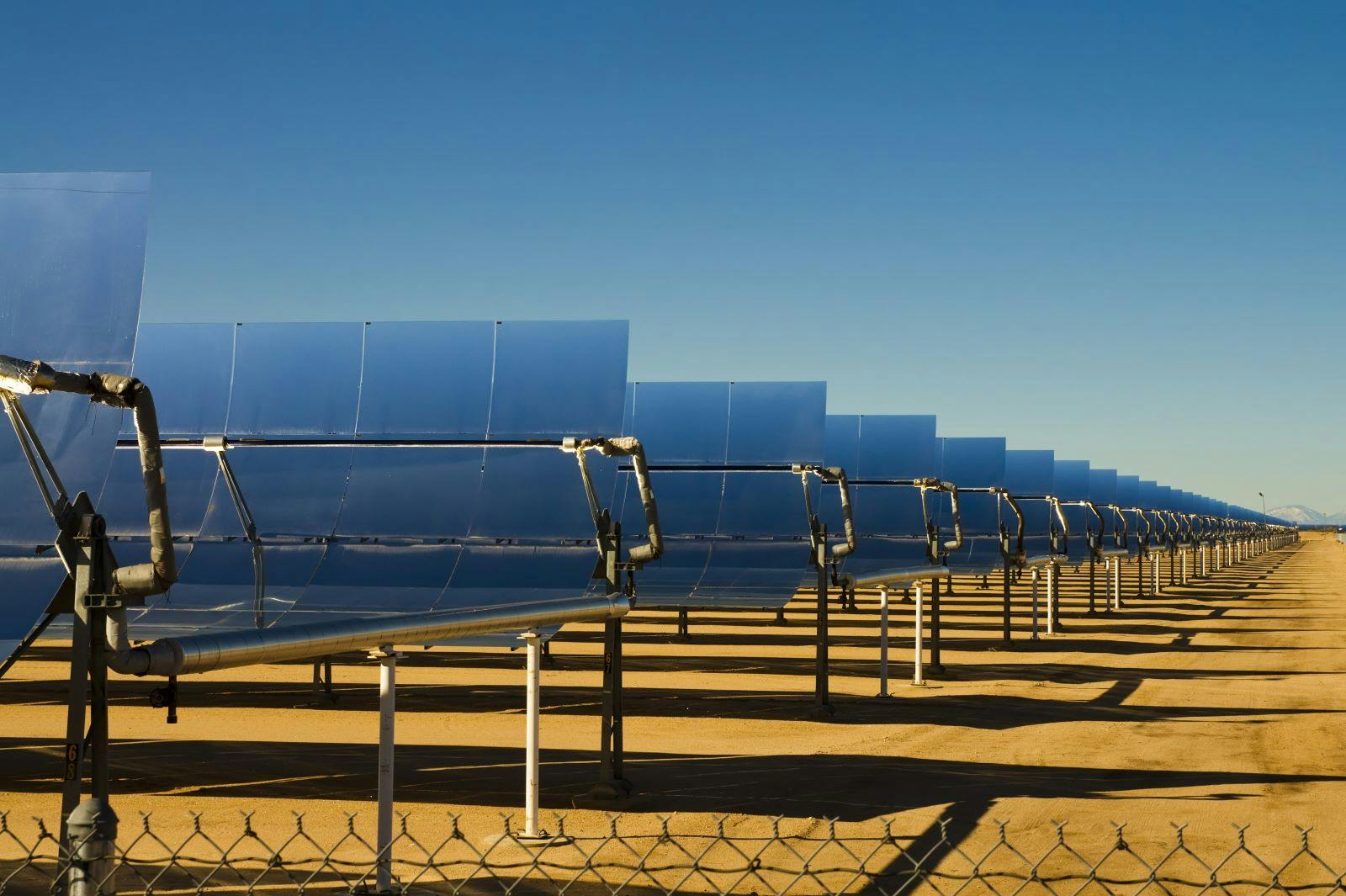 SEGS solar thermal energy electricity plant with parabolic mirrors concentrating the sunlight