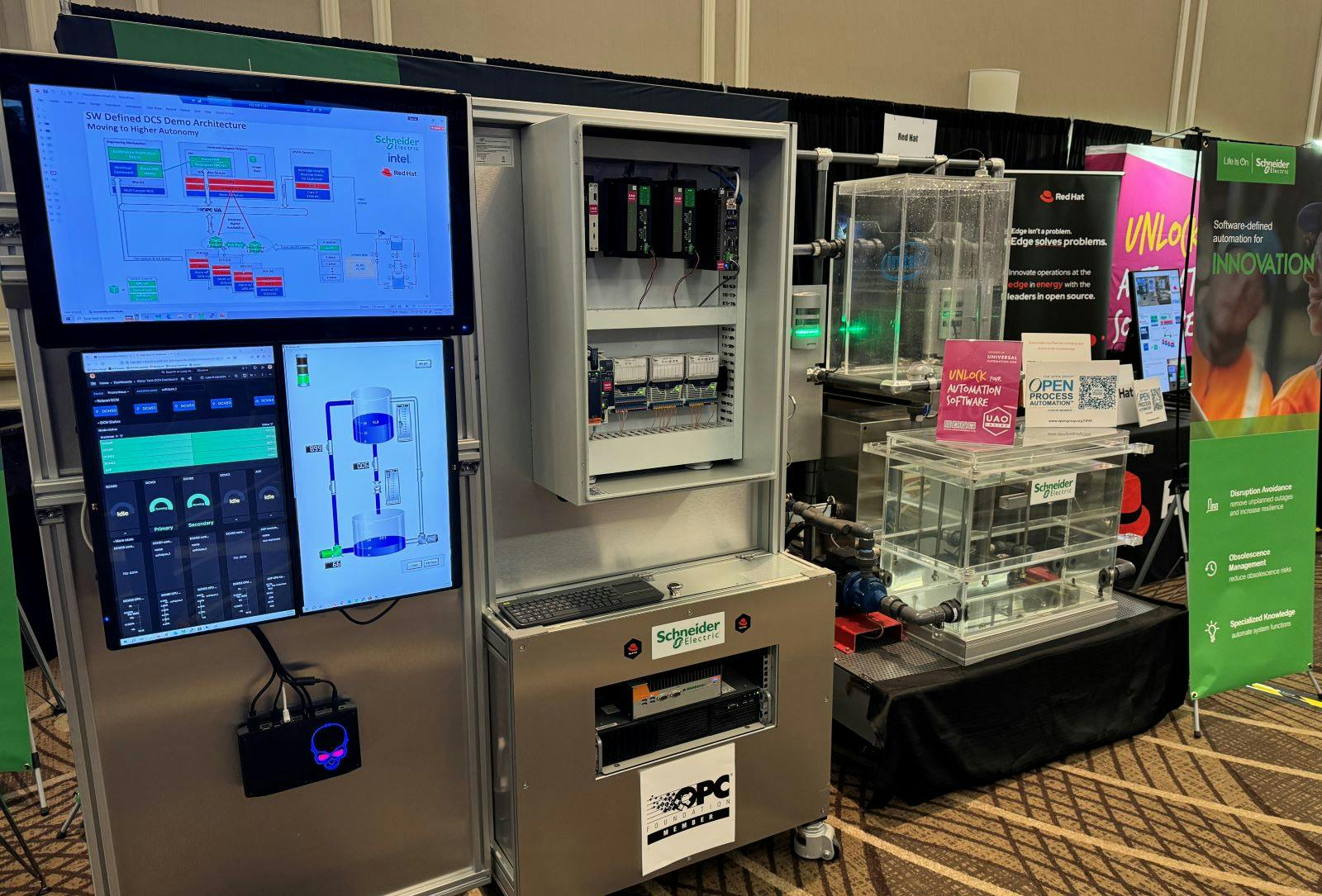 A display shows the integration of Intel's Policy Engine technology into Schneider Electric's EcoStruxture Automation Expert at the 2024 ARC Industry Leader Forum.