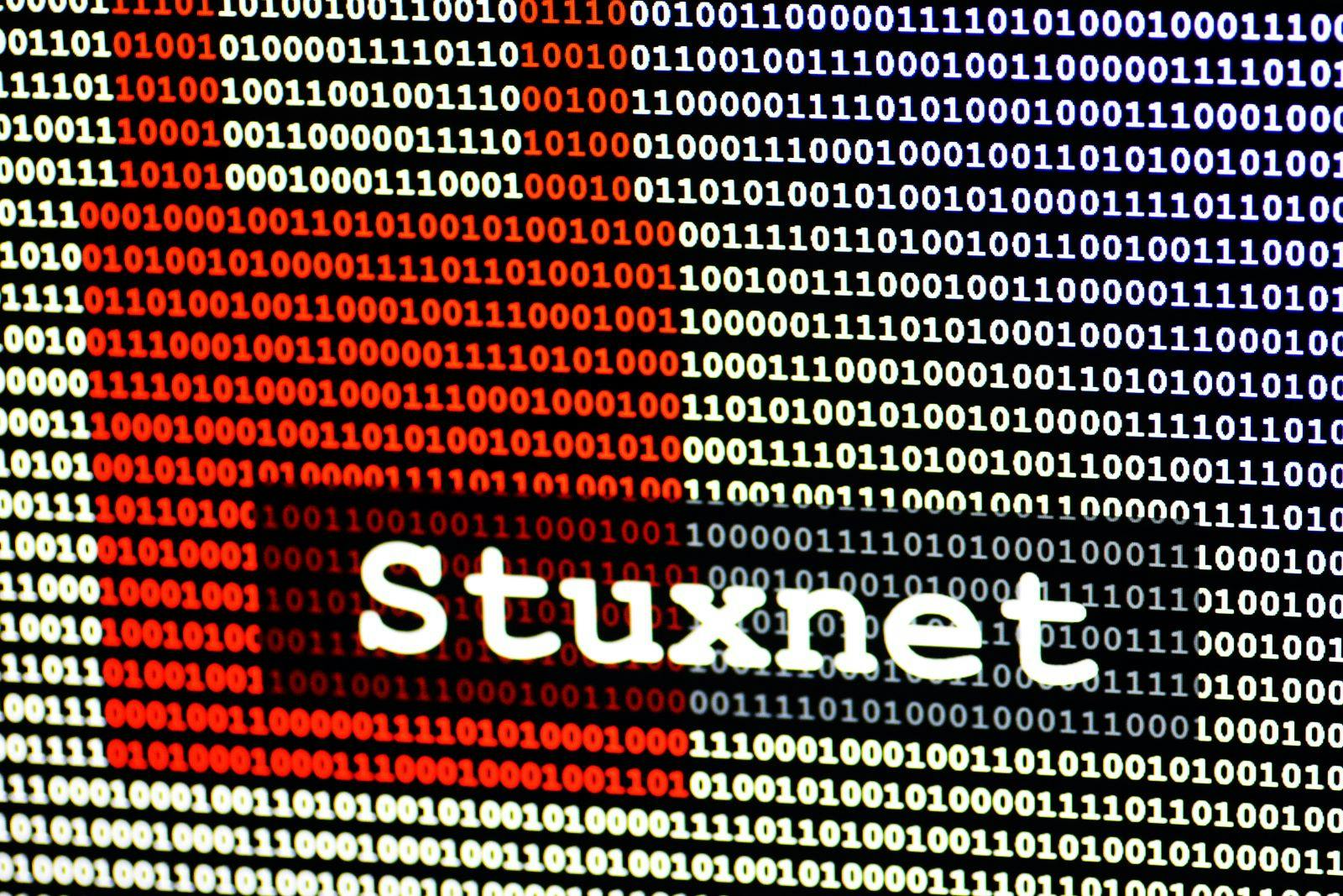 The name of the computer virus Stuxnet in front of a binary background