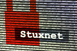 The name of the computer virus Stuxnet in front of a binary background The name of the computer virus Stuxnet in front of a binary background
