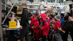Figure 1: Steady streams of students and other visitors take in the digital and cybersecurity demonstrations at Manufacturing times Digital (MxD) institute, which provides participants with programs in digitalized tools, cybersecurity and workforce expertise. Figure 1: Steady streams of students and other visitors take in the digital and cybersecurity demonstrations at Manufacturing times Digital (MxD) institute, which provides participants with programs in digitalized tools, cybersecurity and workforce expertise.