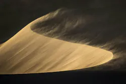 Sand Blows from a sand dune in Sossusvlei. Sand Blows from a sand dune in Sossusvlei.