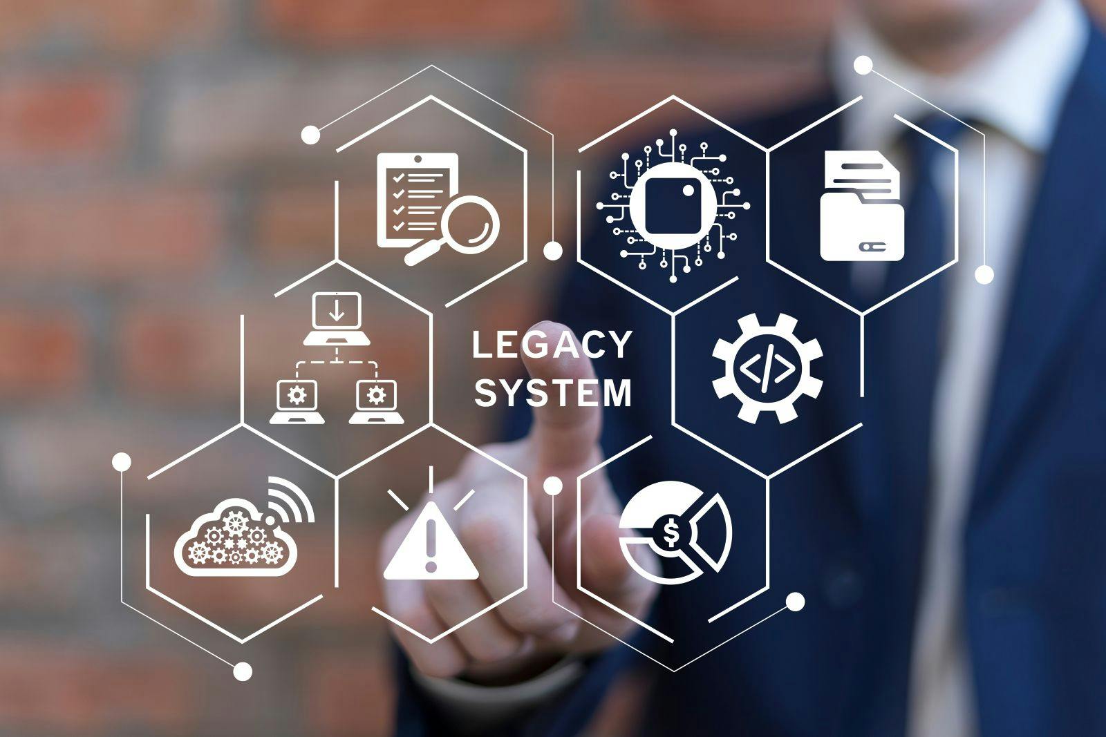 Man using virtual touch screen presses inscription: LEGACY SYSTEMS.