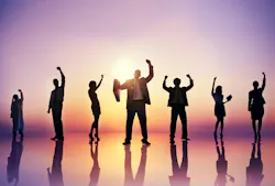 Silhouettes of accomplished businesspeople against a sunrise background. Silhouettes of accomplished businesspeople against a sunrise background.