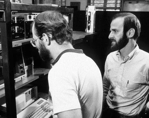 Morari working with a grad student. Morari working with a grad student.