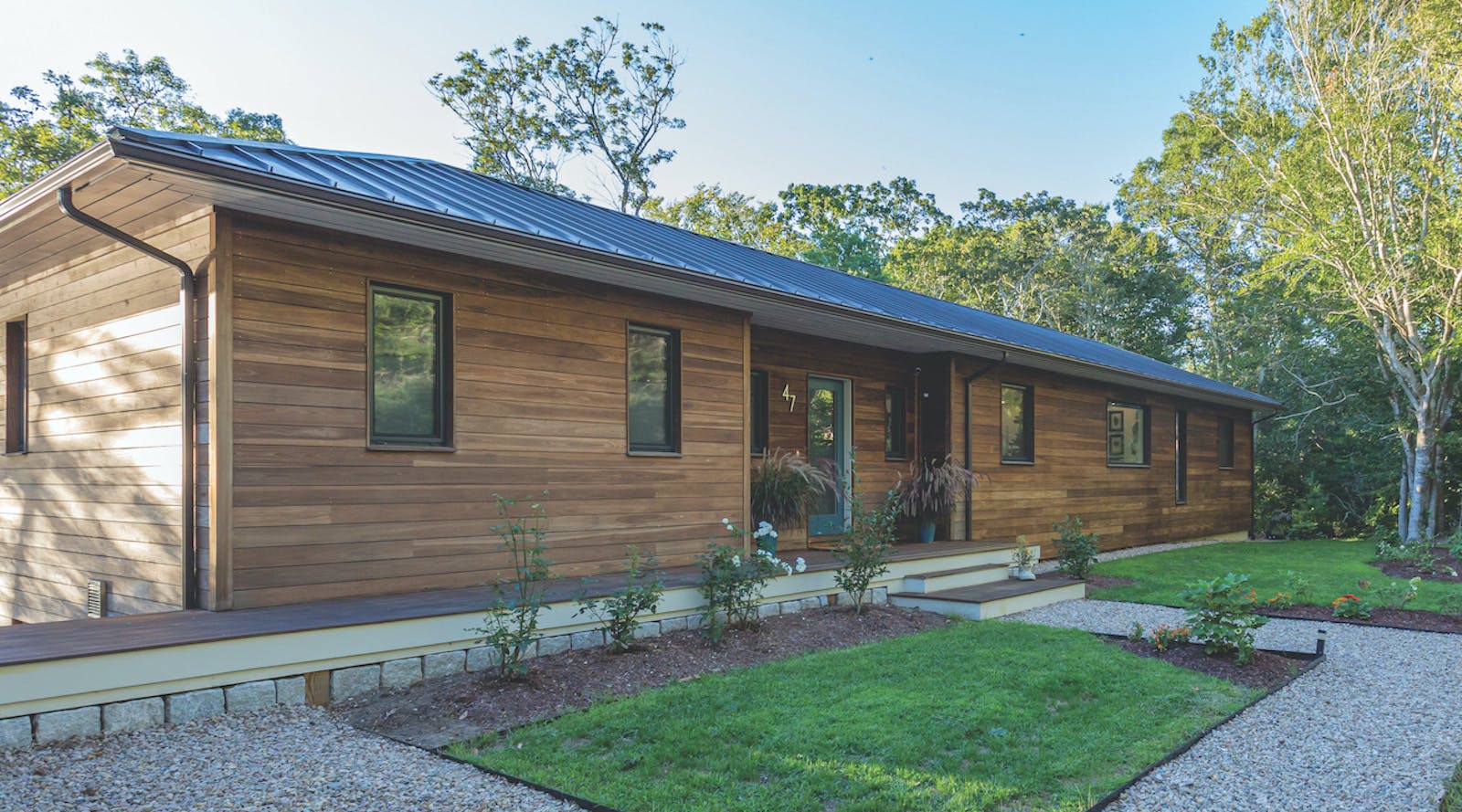 Poplar wood cladding on exterior of Cape Cod high-performance house