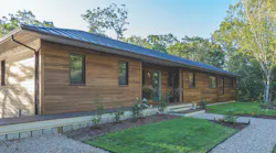 Poplar wood cladding on exterior of Cape Cod high-performance house Poplar wood cladding on exterior of Cape Cod high-performance house