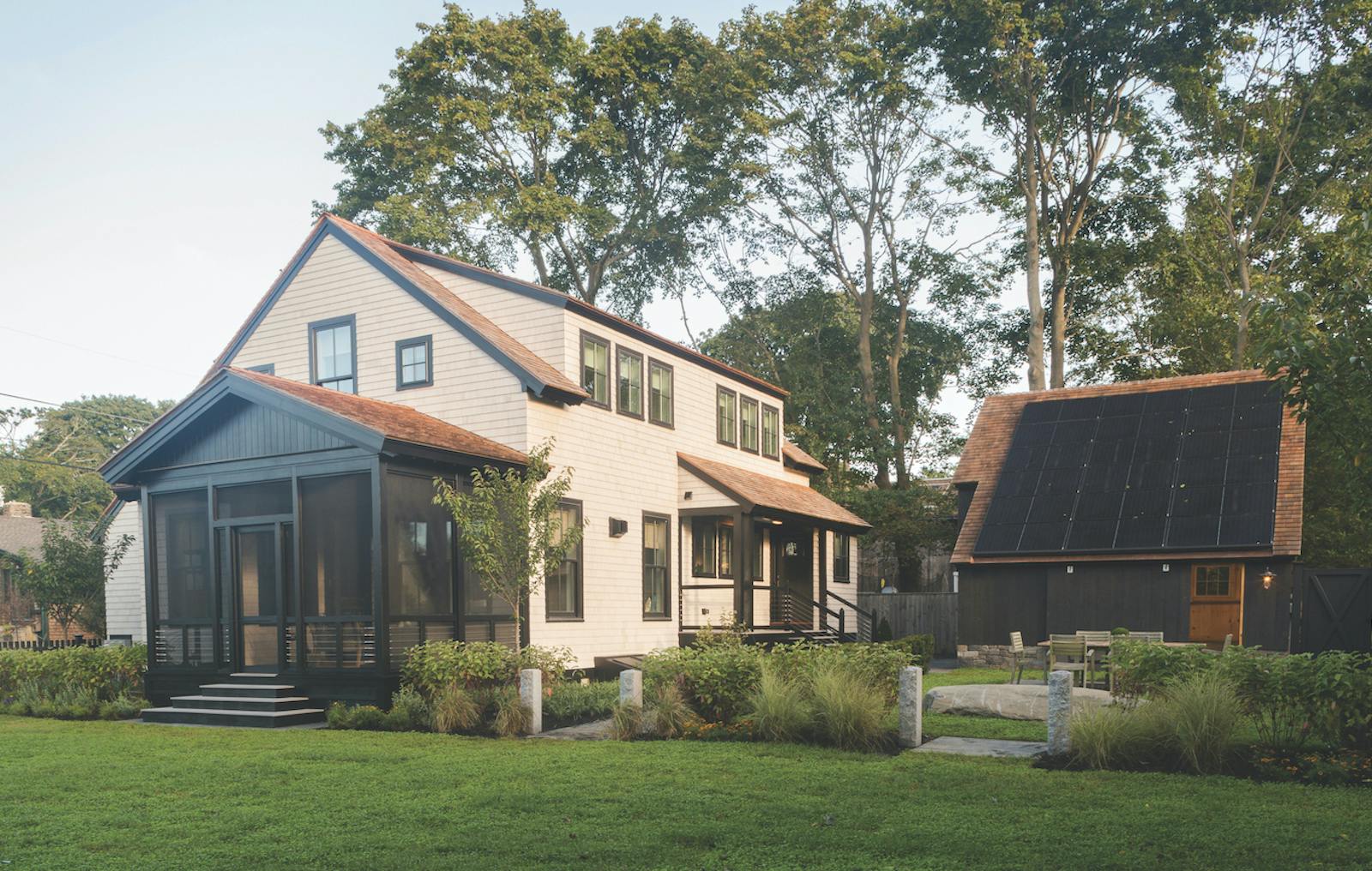 Cottage with solar array on garage in high-performance, net zero house at Jamestown, R.I.