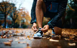 Runner lacing up tennis shoes Runner lacing up tennis shoes