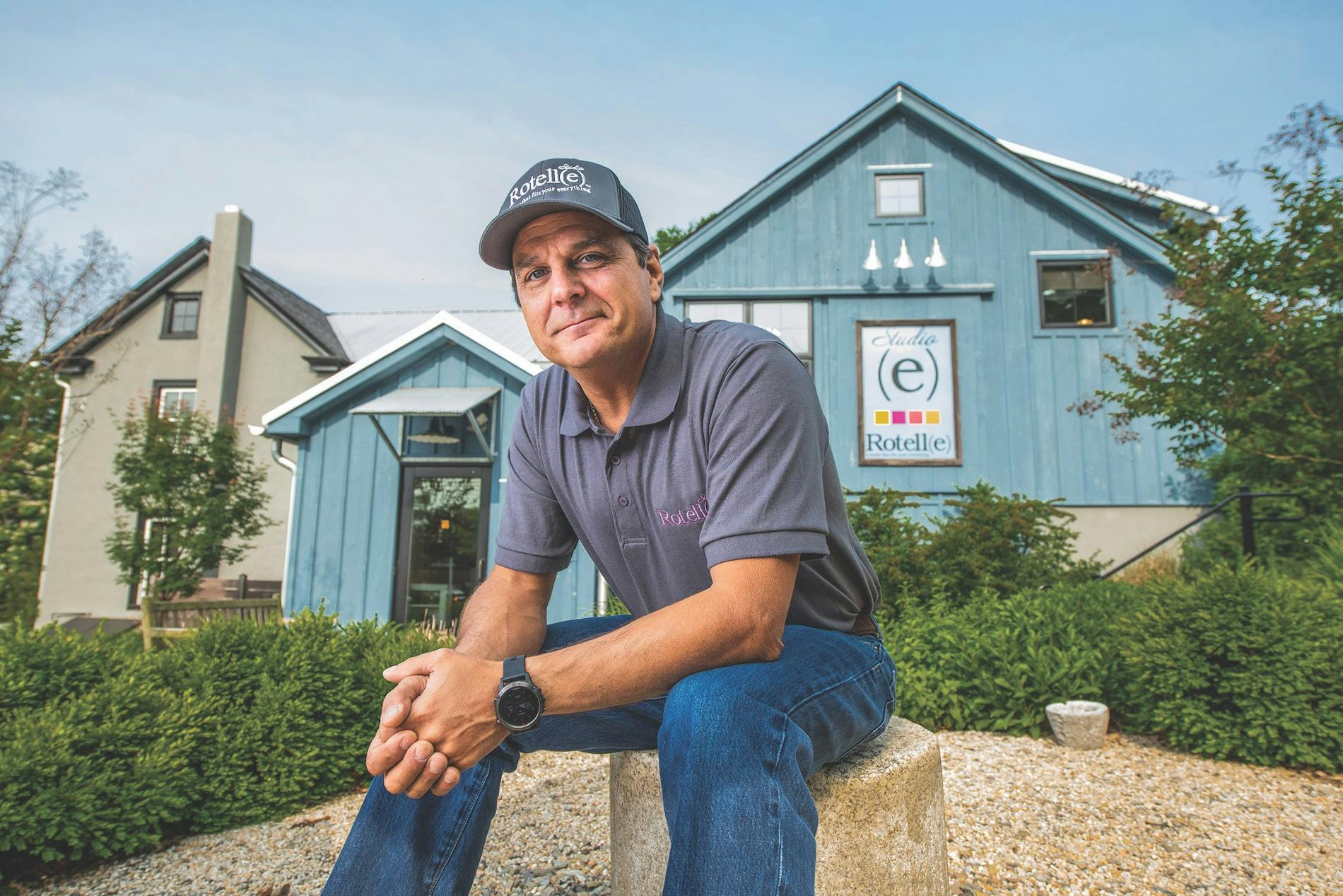 CEO Peter Rotelle sitting in front of his business office