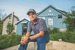 CEO Peter Rotelle sitting in front of his business office CEO Peter Rotelle sitting in front of his business office