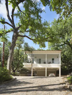 The steepest part of the hill falls away from the ADU, so building a retaining wall at the end of the drive prevents extreme water runoff while repurposing stones cleared from the construction site. The steepest part of the hill falls away from the ADU, so building a retaining wall at the end of the drive prevents extreme water runoff while repurposing stones cleared from the construction site.