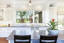 Custom home kitchen with large window view Custom home kitchen with large window view