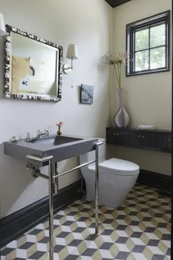 Powder room with geometric pattern on floor tile Powder room with geometric pattern on floor tile