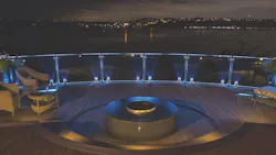 Deck with fire pit feature and night time view of the bay Deck with fire pit feature and night time view of the bay