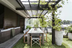 Outdoor loggia and seating on rooftop terrace Outdoor loggia and seating on rooftop terrace