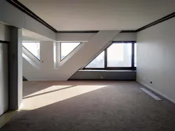 V-shaped steel bracing is covered by drywall in carpeted condo V-shaped steel bracing is covered by drywall in carpeted condo