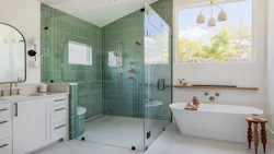 Bathroom with large roll-in showers with green tiling, freestanding tub and white contemporary vanity Bathroom with large roll-in showers with green tiling, freestanding tub and white contemporary vanity