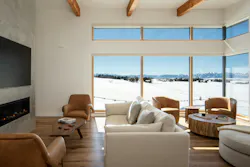 A contemporary living room with large windows A contemporary living room with large windows
