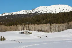 A Wyoming home in a snowy meadow A Wyoming home in a snowy meadow