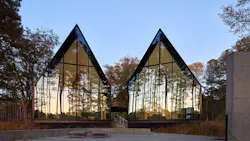Steeplechase House with steep gabled roof forms and reflective glass panels Steeplechase House with steep gabled roof forms and reflective glass panels