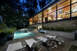 Wood deck around pool on a sloping site Wood deck around pool on a sloping site