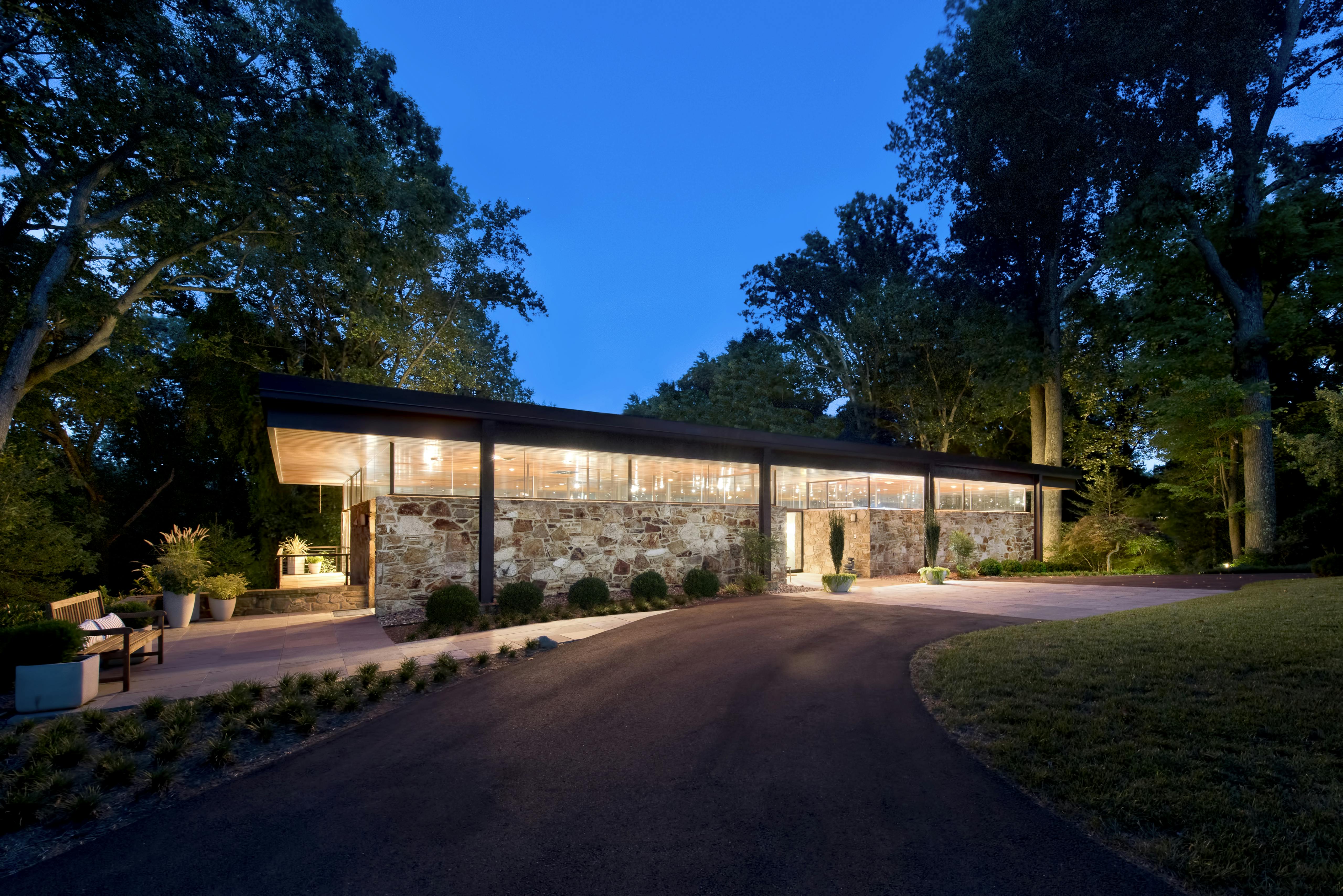 House with clerestory windows at nighttime lit up