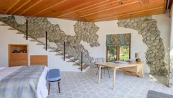 A second set of stairs in the ADU leads down to the bedroom. A second set of stairs in the ADU leads down to the bedroom.