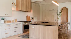 With the goal of achieving a modern organic design style, the designers behind this custom kitchen opted for neutral tones, heavy texture, and natural light. With the goal of achieving a modern organic design style, the designers behind this custom kitchen opted for neutral tones, heavy texture, and natural light.