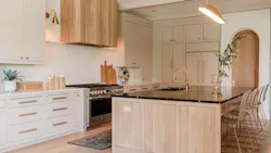 With the goal of achieving a modern organic design style, the designers behind this custom kitchen opted for neutral tones, heavy texture, and natural light. With the goal of achieving a modern organic design style, the designers behind this custom kitchen opted for neutral tones, heavy texture, and natural light.