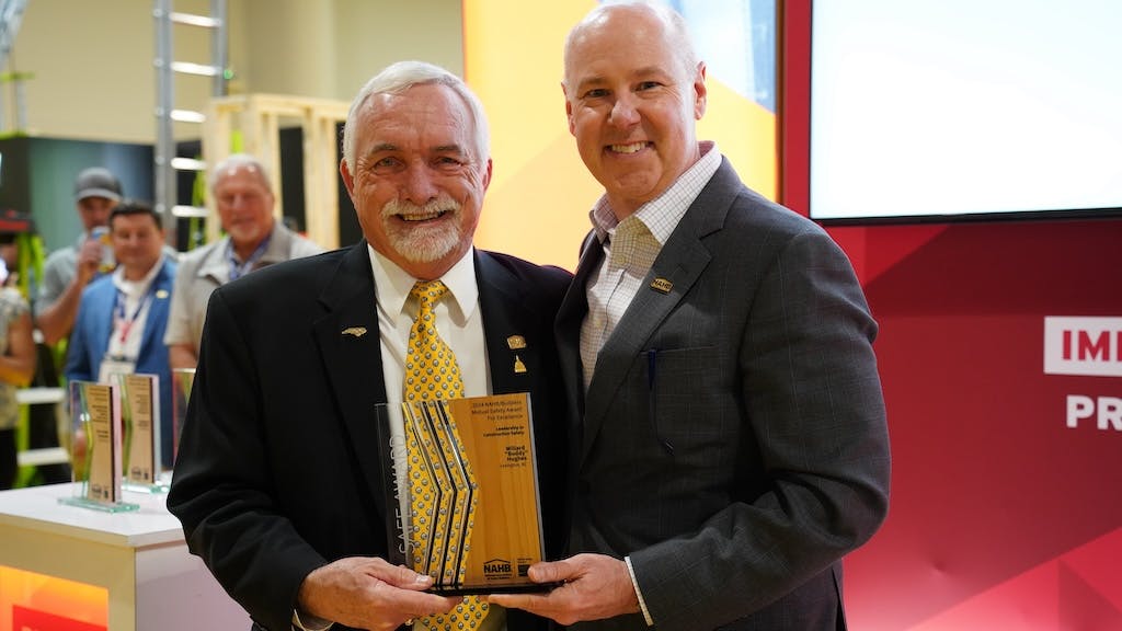 NAHB's Buddy Hughes (left) and Jim Tobin (right) pose together with Builders Mutual Safety Award for Excellence (SAFE)