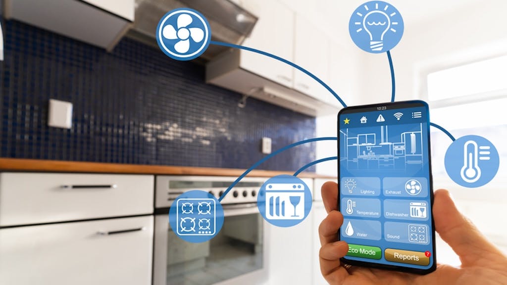 A luxury homeowner uses smart kitchen features on their phone