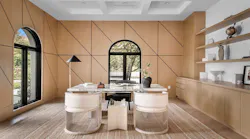 A wood-drenched interior with light wood flooring, walls, and cabinetry, reflecting the 'wood-drenching' trend A wood-drenched interior with light wood flooring, walls, and cabinetry, reflecting the 'wood-drenching' trend