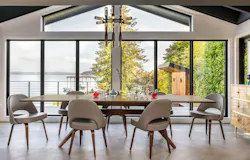 Mid-century modern dining area overlooking the lake on Mercer Island | Dyna Builders Mid-century modern dining area overlooking the lake on Mercer Island | Dyna Builders