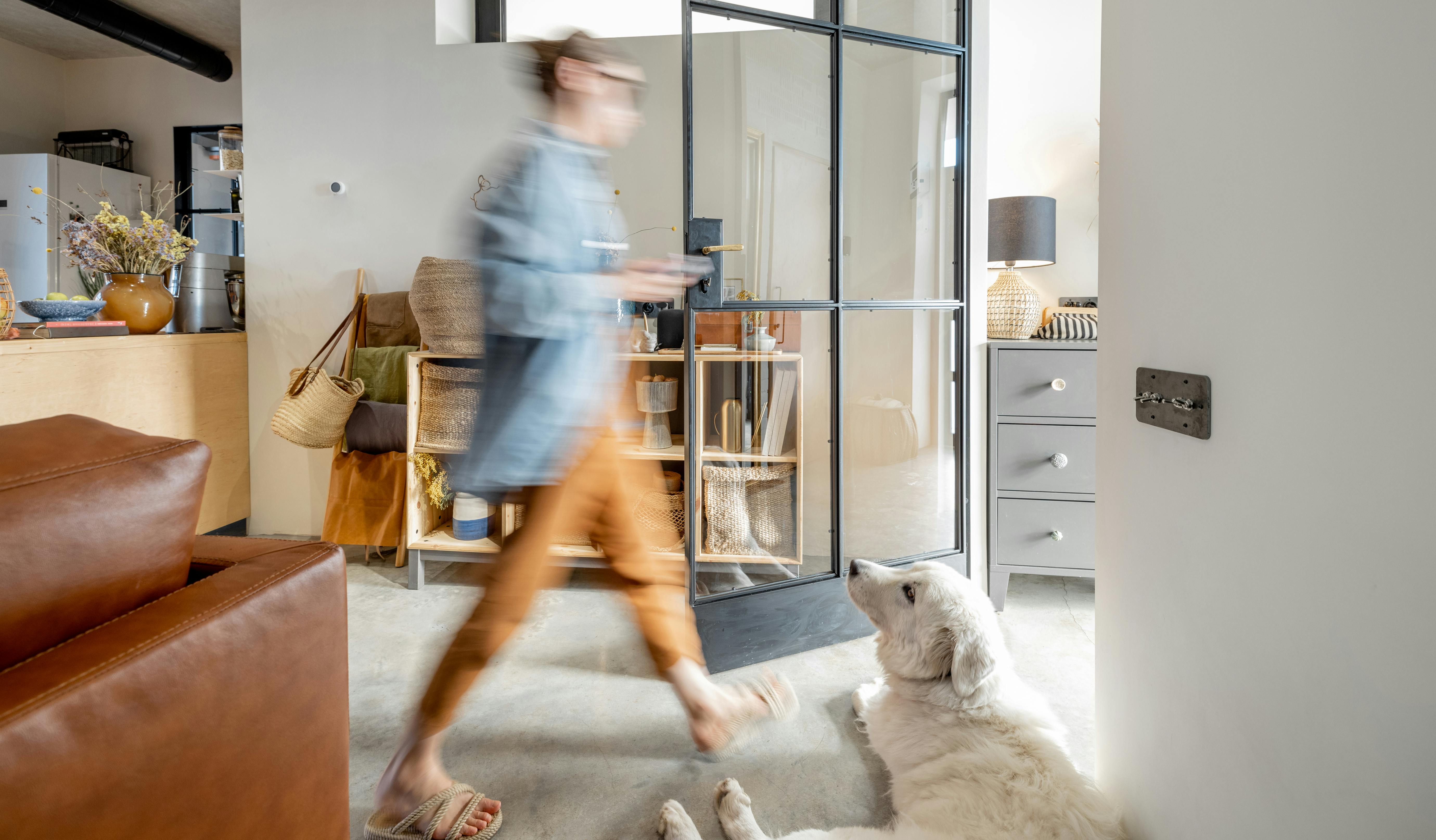 Construction concierge walking through a modern interior (blurred image)