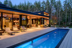 Backyard of Deer Harbor home, featuring a swimming pool and seating area Backyard of Deer Harbor home, featuring a swimming pool and seating area