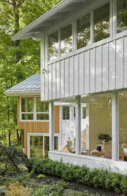 Asphalt shingles were replaced with a standing-seam steel roof, selected for durability, recyclability, and as a budget-conscious alternative to zinc. Asphalt shingles were replaced with a standing-seam steel roof, selected for durability, recyclability, and as a budget-conscious alternative to zinc.