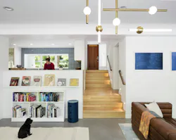 White walls and polished concrete floors tie together the split-level interior, keeping it bright and open, but true to the home’s midcentury roots. White walls and polished concrete floors tie together the split-level interior, keeping it bright and open, but true to the home’s midcentury roots.