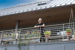 Architect Wayne Turett on the balcony of his Long Island Passive House Architect Wayne Turett on the balcony of his Long Island Passive House