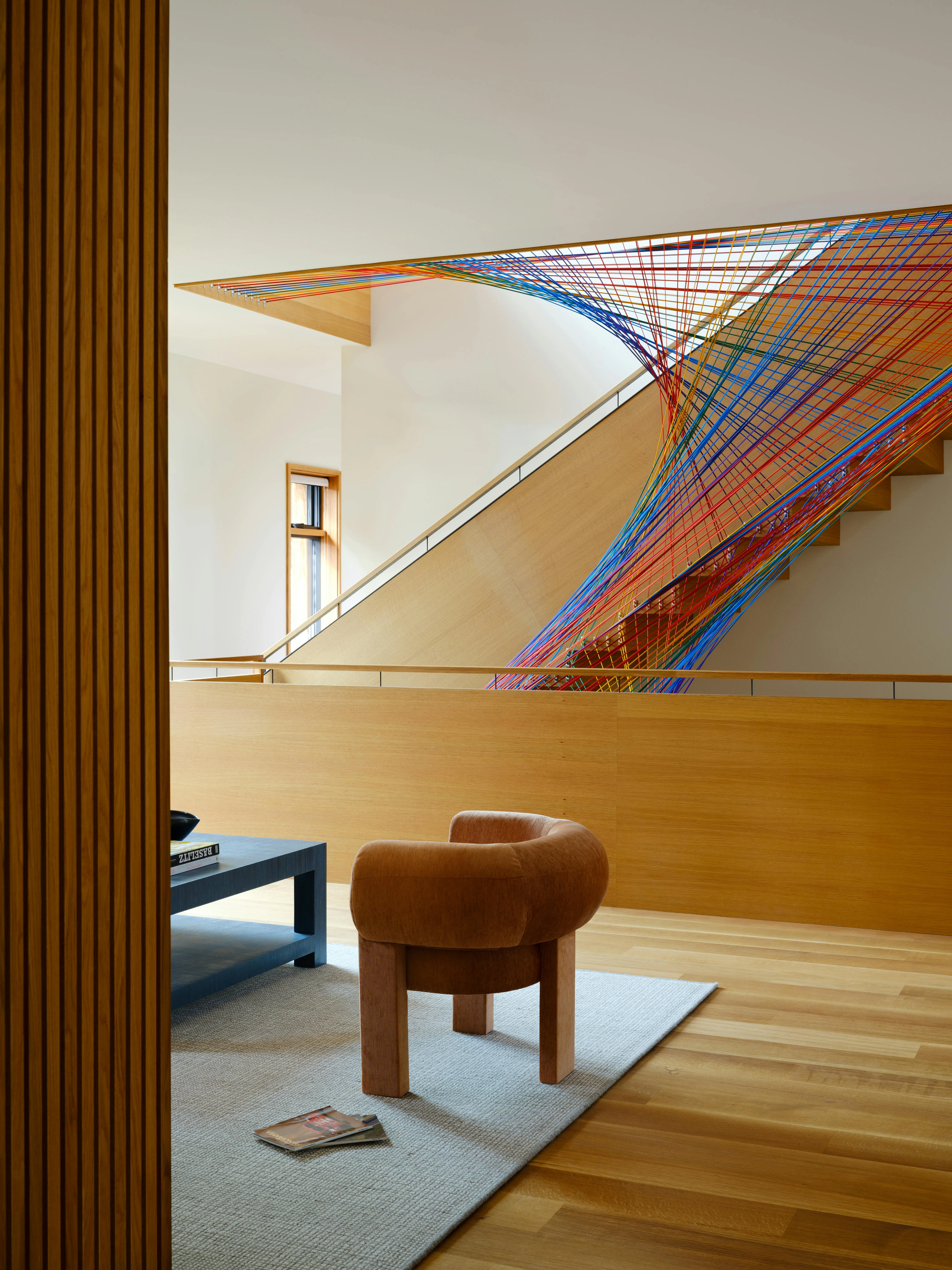 The design team worked with artisan retailer Treenet Collective to create a custom rainbow netting for the space. The design team worked with artisan retailer Treenet Collective to create a custom rainbow netting for the space.