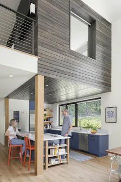 Glimpse of a cantilever loft overlooking the living area in this passive house Glimpse of a cantilever loft overlooking the living area in this passive house